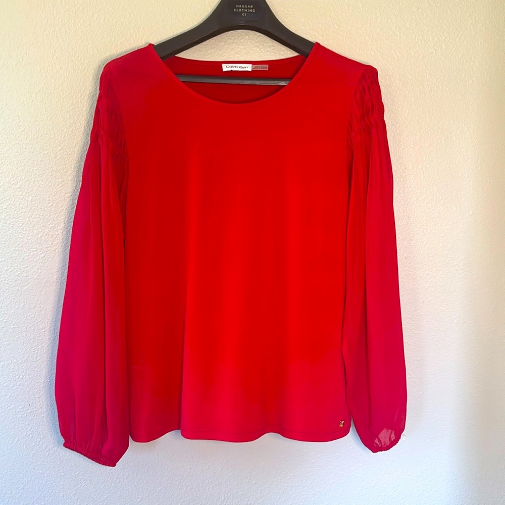 Red Calvin Klein blouse with sheer sleeves